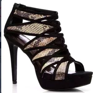 Carlos Santana black and snake skin strappy heels.